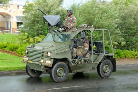 Bloemontein, South Africa - February 21, 2014: The Armed Forces parade the streets of Bloemfontein on February 21st, 2014 to commemorate World Armed Forces Day. Wasp rapid reconnaissance vehicle drive by